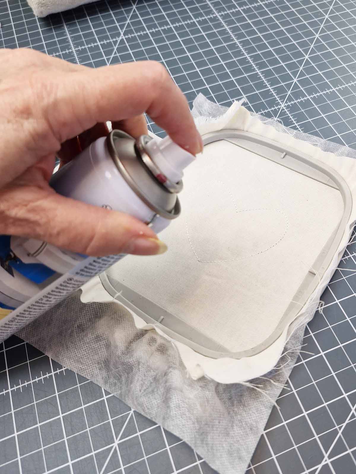 Placement outline stitched on stabilizer and fabric secured with temporary spray adhesive