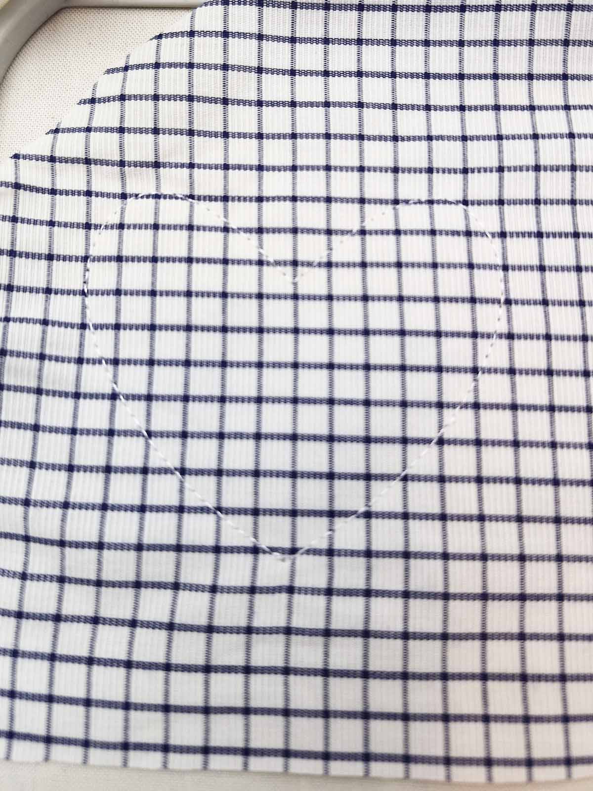 Heart appliqué stitched in place before trimming excess fabric