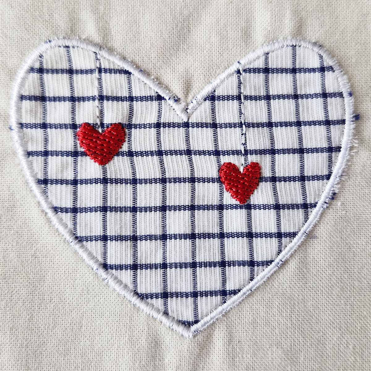 Finished machine appliqué heart with additional embroidered details