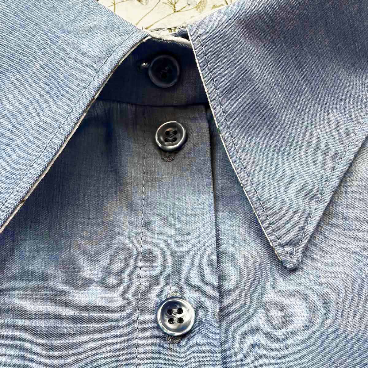 embroidered buttonhole on shirt with buttons closed