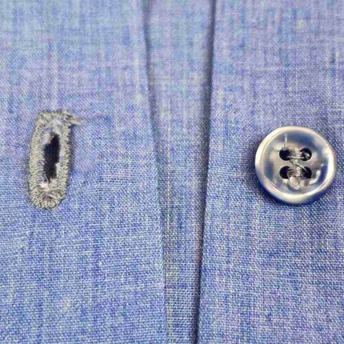 close up of embroidered buttonhole for 11mm shirt button