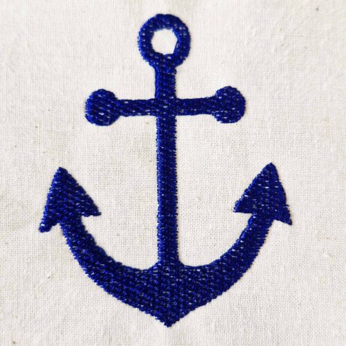 Simple anchor embroidery design stitched in blue thread on cotton fabric