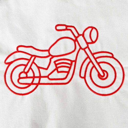 Motorcycle satin stitch embroidery design stitched in red on cotton fabric