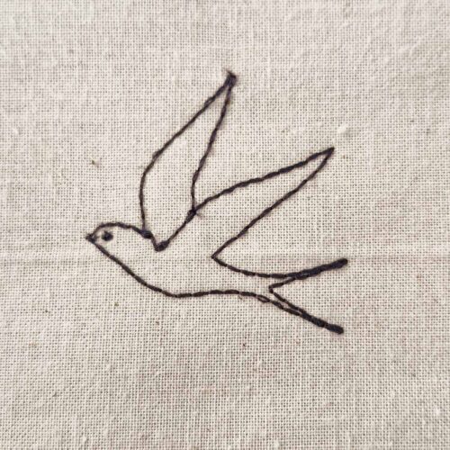 Minimalist swallow line art machine embroidery design with a simple stitched outline.
